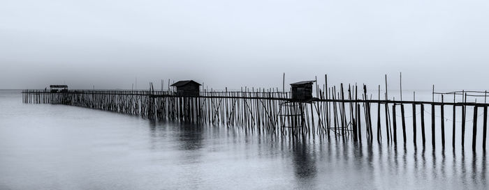 Pier on sea against sky