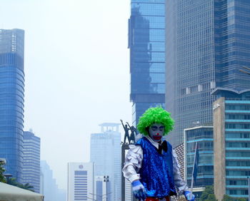 Man against modern buildings in city