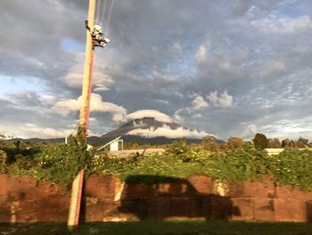 Built structure on field against sky