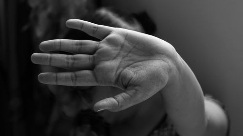 Close-up of woman showing stop gesture