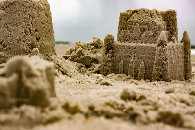 Close-up of rocks on land against sky