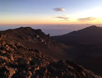 Scenic view of mountains against sky during sunset