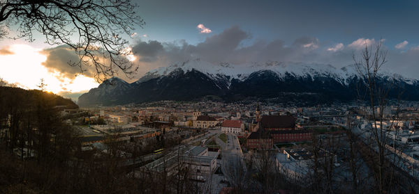 Aerial view of townscape against sky during sunset