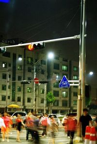 Illuminated city street at night