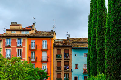 Buildings in city against sky