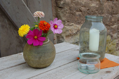 Close-up of flowers in jar on table