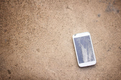 High angle view of plastic bag on sand