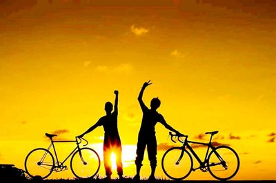 Silhouette people at sunset