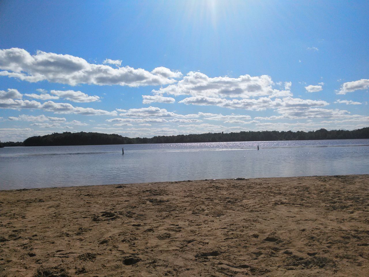 water, tranquil scene, sky, tranquility, scenics, beach, beauty in nature, sea, sunlight, nature, shore, sand, idyllic, sun, blue, cloud - sky, sunbeam, reflection, cloud, lake