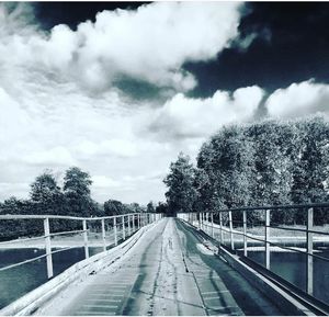 Railroad track with bridge in background