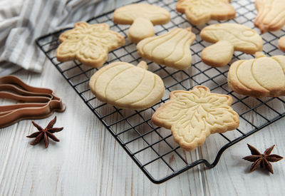 Autumn baking. cookies in the form of pumpkin and leaves on the table. cozy autumn concept.