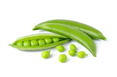 Close-up of green chili pepper against white background