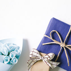 High angle view of gifts over white background