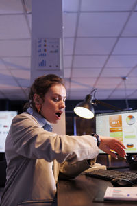 Portrait of young man working at office