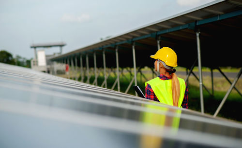 A young female solar cell engineer is working hard. working in alternative energy solar energy