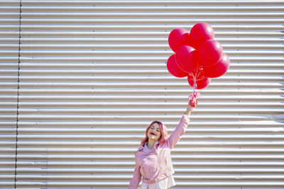 Full length of a woman holding umbrella