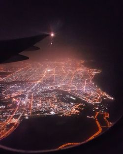 Aerial view of illuminated city at night