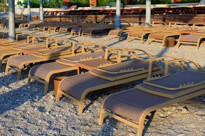 High angle view of empty chairs in snow