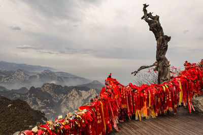 Panoramic view of cross on mountain against sky