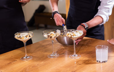 Midsection of man preparing food on table