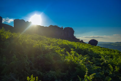 Scenic view of mountains against clear blue sky