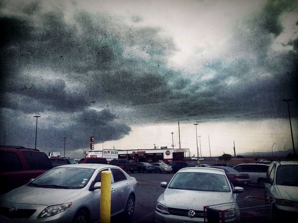 CARS IN CITY AGAINST SKY