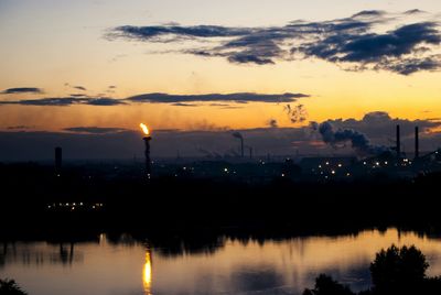 Scenic view of lake at sunset