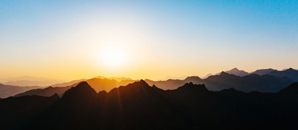 Scenic view of mountains against sky during sunset