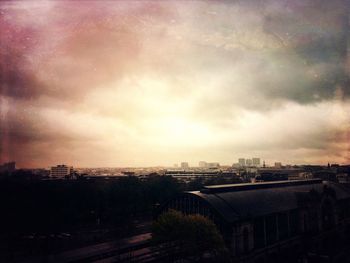 Buildings against cloudy sky