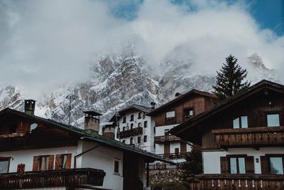 Low angle view of houses and buildings against sky