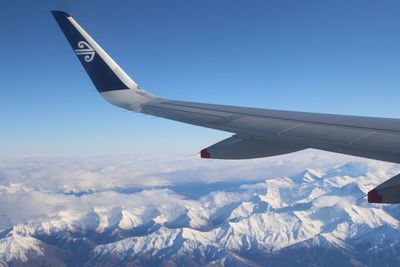 Airplane flying above landscape