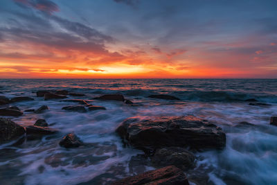 Scenic view of sea against sky during sunset