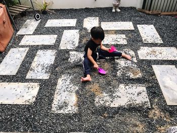 High angle view of girl standing on street