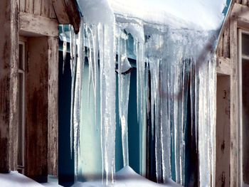 Panoramic shot of icicles on building during winter