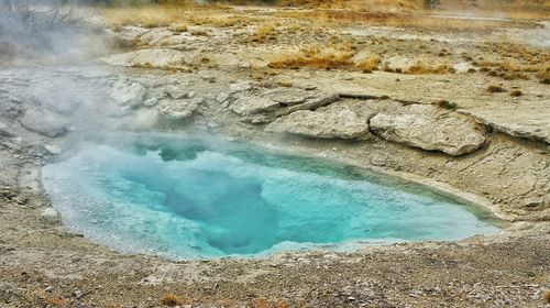 Steam erupting from geyser