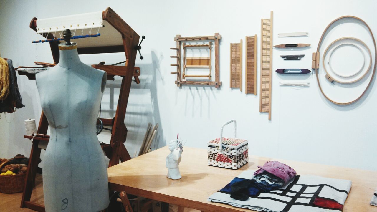 table, indoors, chair, still life, wood - material, absence, home interior, hanging, variation, house, wall - building feature, no people, day, art and craft, book, creativity, empty, built structure, paper, large group of objects