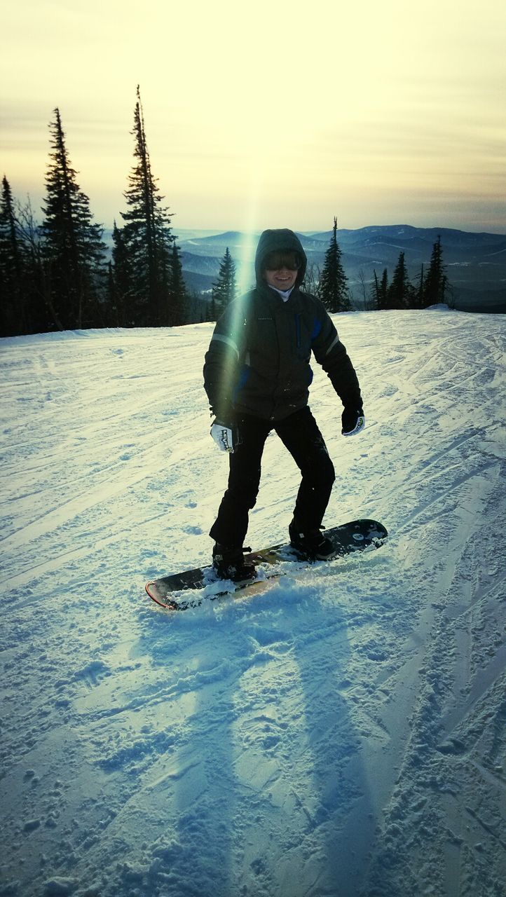 winter, lifestyles, full length, snow, leisure activity, cold temperature, person, season, fun, enjoyment, childhood, weather, looking at camera, portrait, front view, young adult, happiness, standing