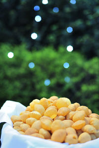 Puri kept in a bowl, outdoors.