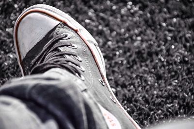 Close-up of shoes on tiled floor