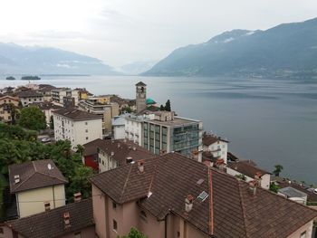 High angle view of townscape and mountains against sky