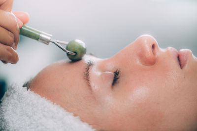 Close-up of woman getting massage therapy at spa