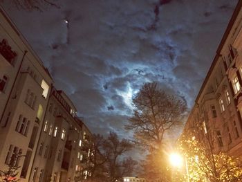 Low angle view of illuminated city against sky