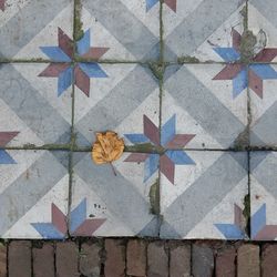 Multi colored umbrellas on tiled floor