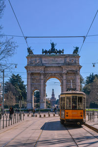 View of city street against blue sky