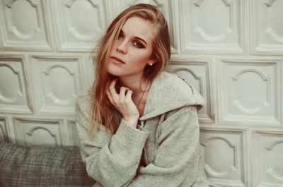 Young woman looking at door