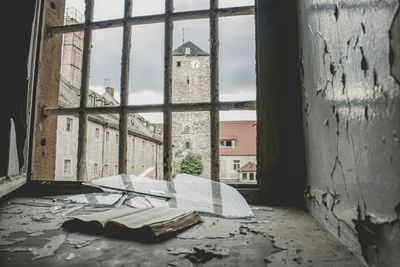 Abandoned building seen through window