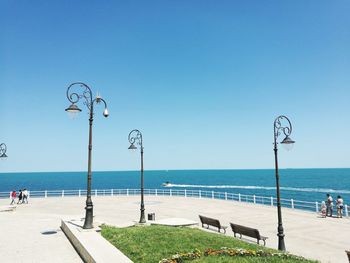 Scenic view of sea against clear blue sky