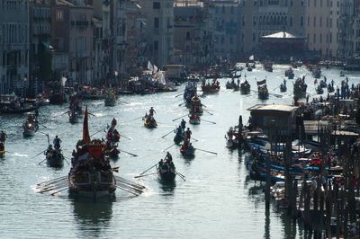 High angle view of people on boats in city