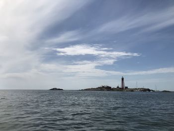 Scenic view of sea by building against sky