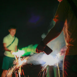 Blurred motion of man and woman at night